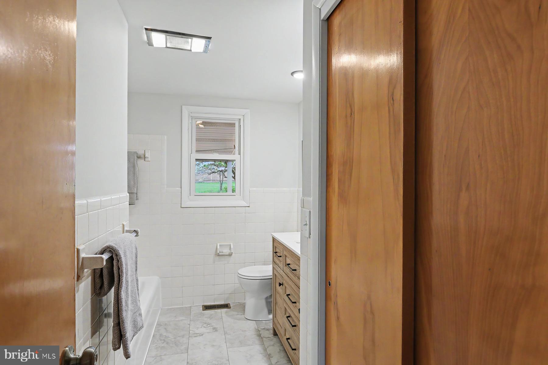 802 Willow Lane Lebanon, PA 17046 - Photo 11 of 23 a bathroom with a granite countertop toilet and a sink