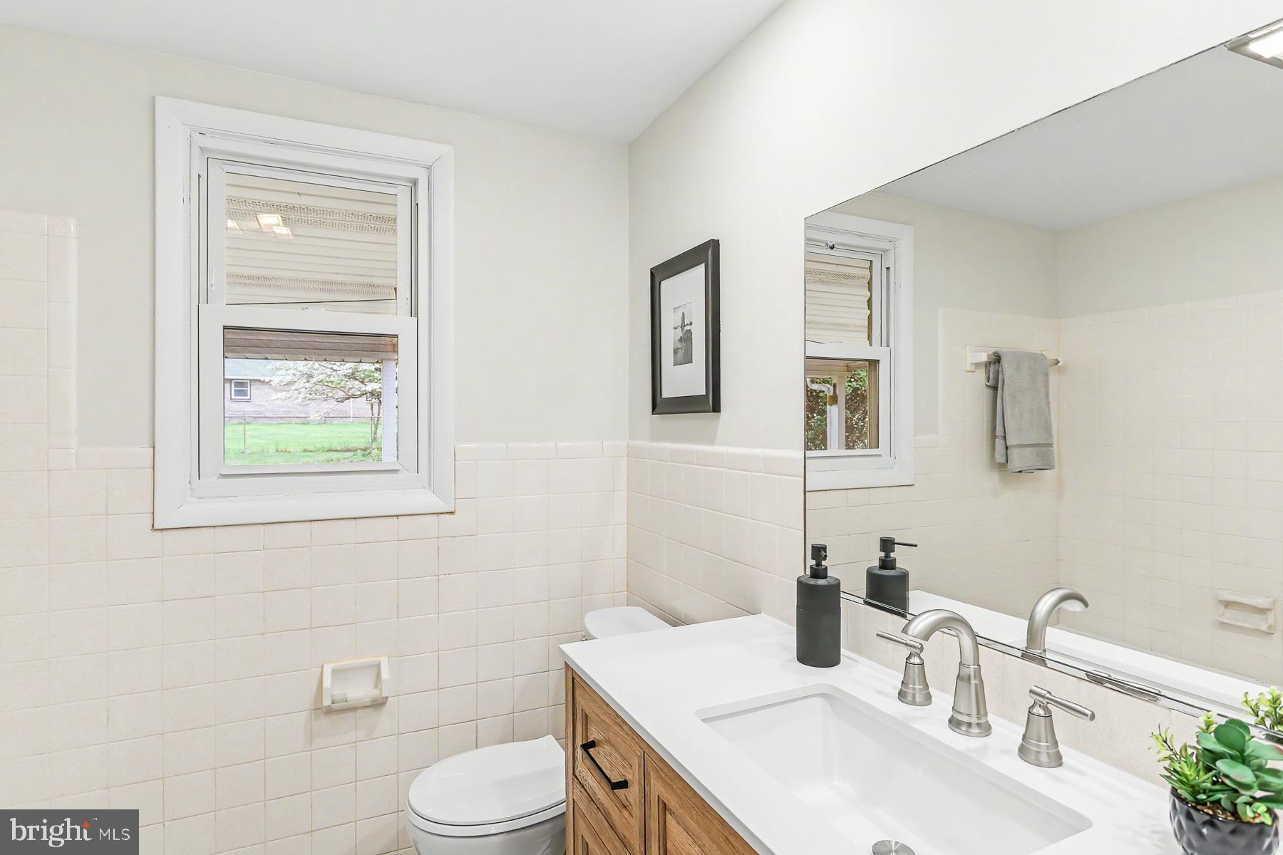 802 Willow Lane Lebanon, PA 17046 - Photo 12 of 23 a bathroom with a sink toilet and mirror
