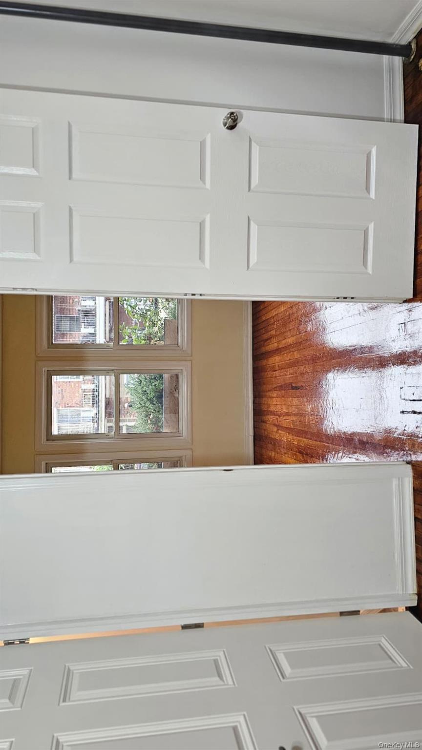 55-23 97th Place Queens, NY 11368 - Photo 7 of 7 a view of a room that has a window in it