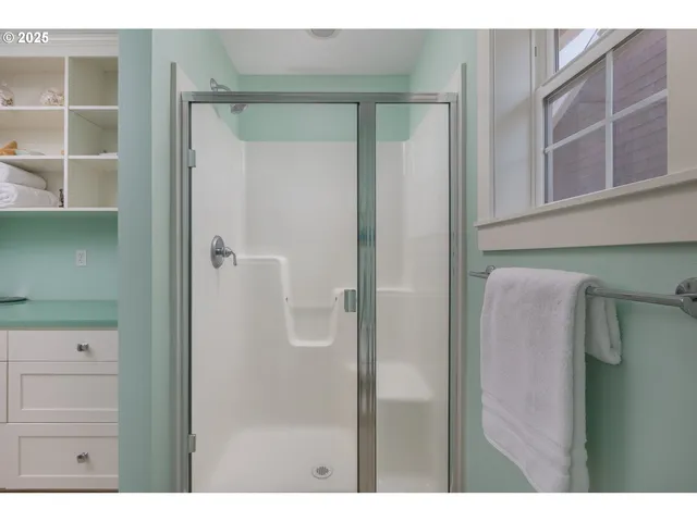 a bedroom with two beds and a couch