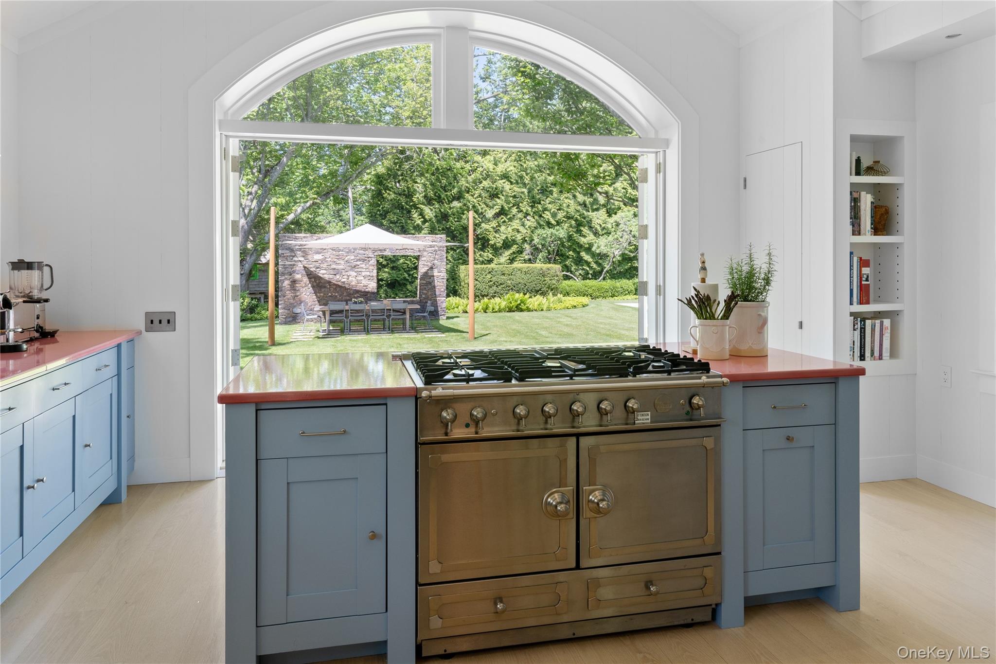 182 Church Lane Bridgehampton, NY 11932 - Photo 12 of 37 a kitchen with granite countertop white cabinets and a large window