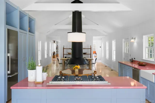 a living room with table and chairs