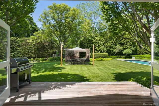 a view of a patio with a big yard