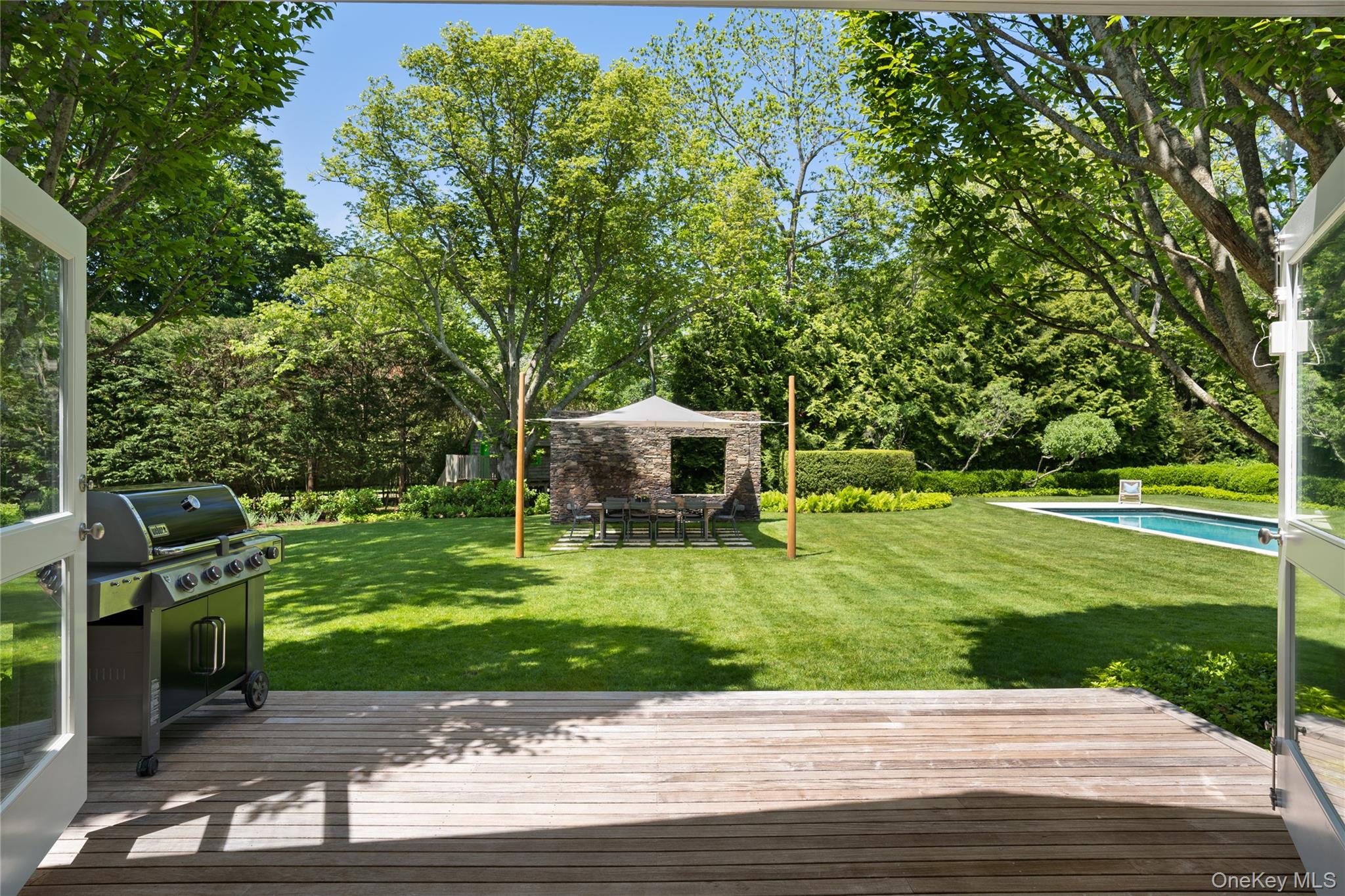 182 Church Lane Bridgehampton, NY 11932 - Photo 14 of 37 a view of a patio with a big yard