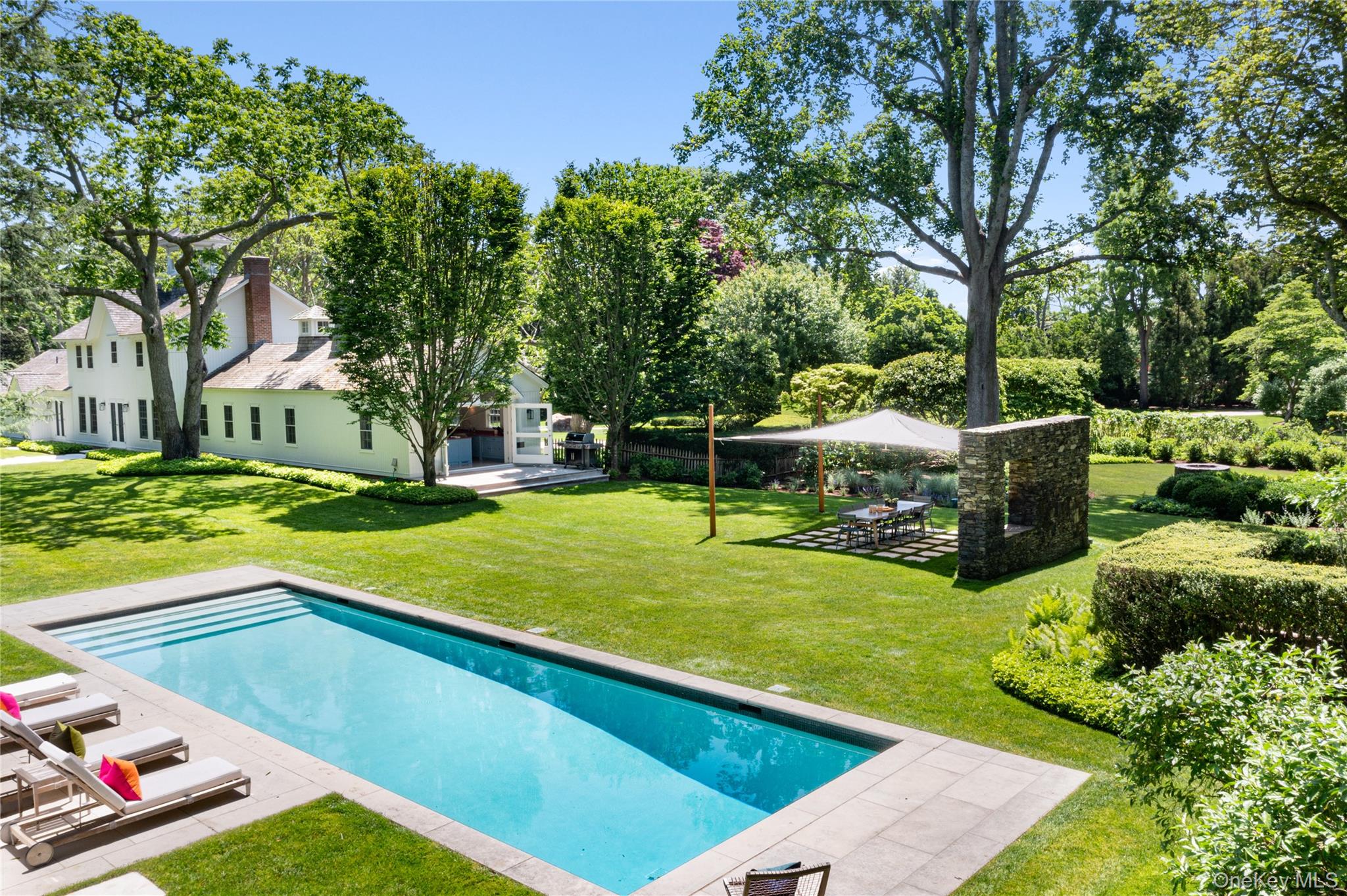 182 Church Lane Bridgehampton, NY 11932 - Photo 2 of 37 a view of a backyard with sitting area