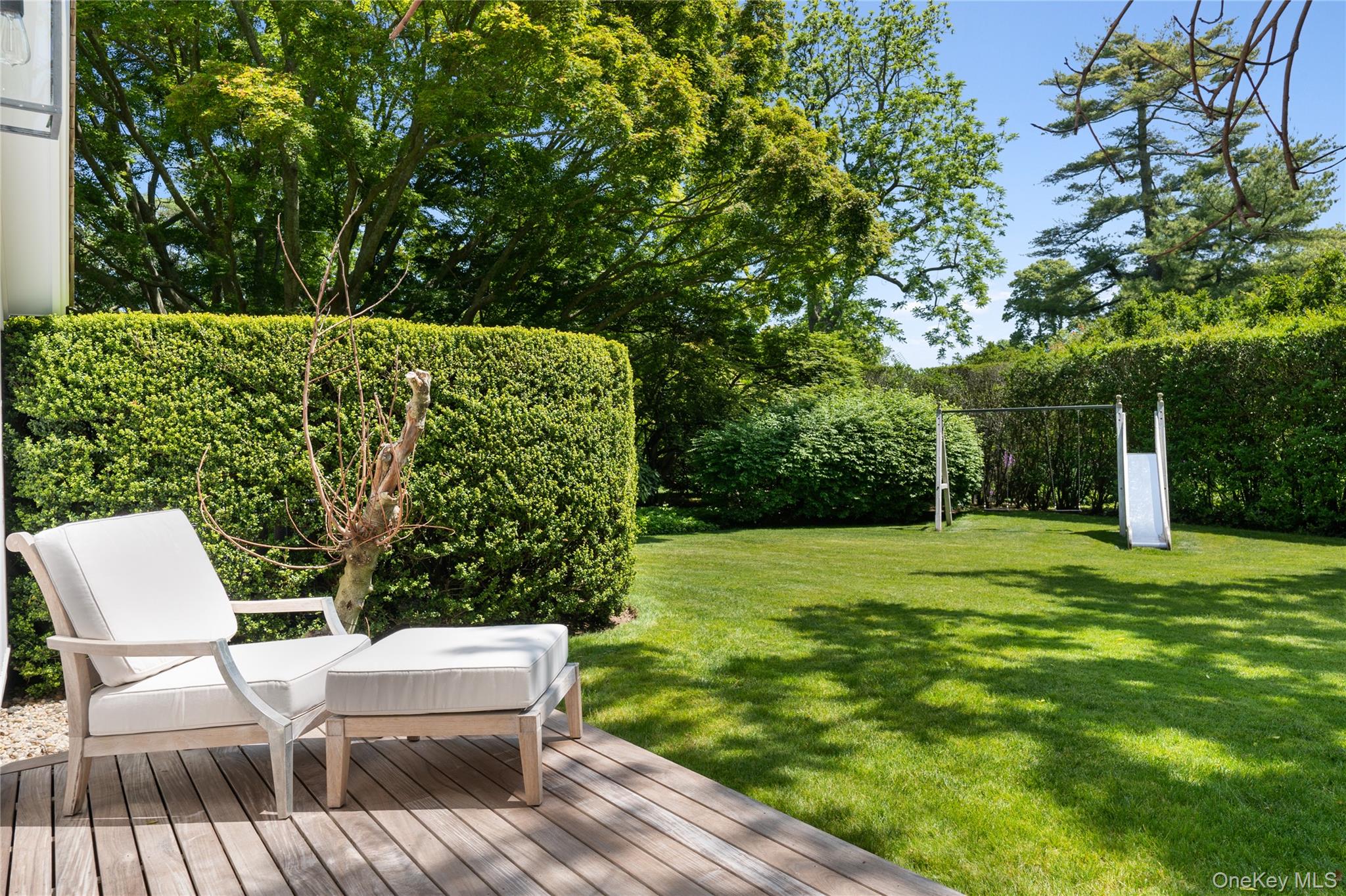 182 Church Lane Bridgehampton, NY 11932 - Photo 22 of 37 a view of a two chairs in the garden