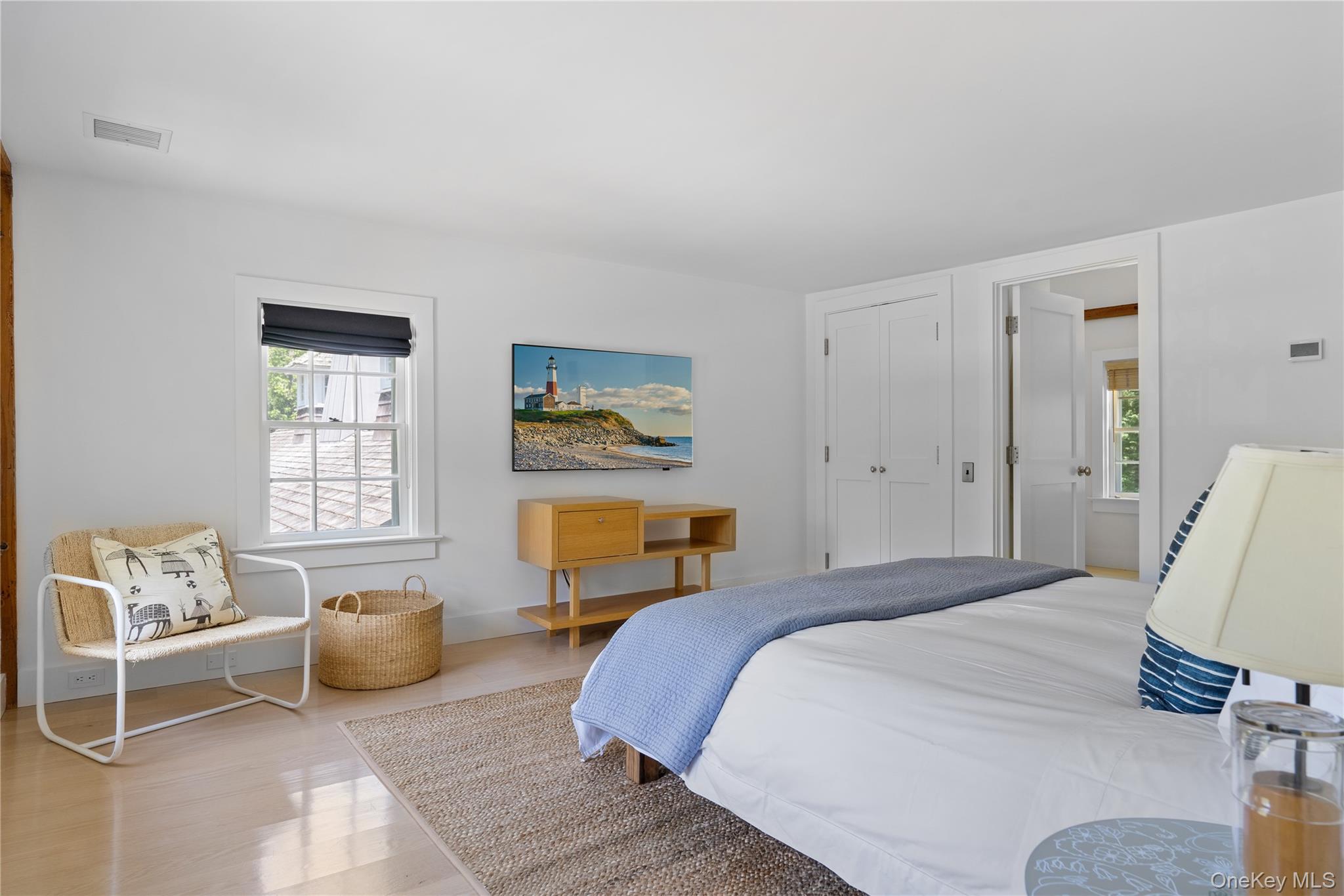 182 Church Lane Bridgehampton, NY 11932 - Photo 25 of 37 a bedroom with furniture and a window