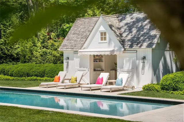 a kitchen with white cabinets and a sink