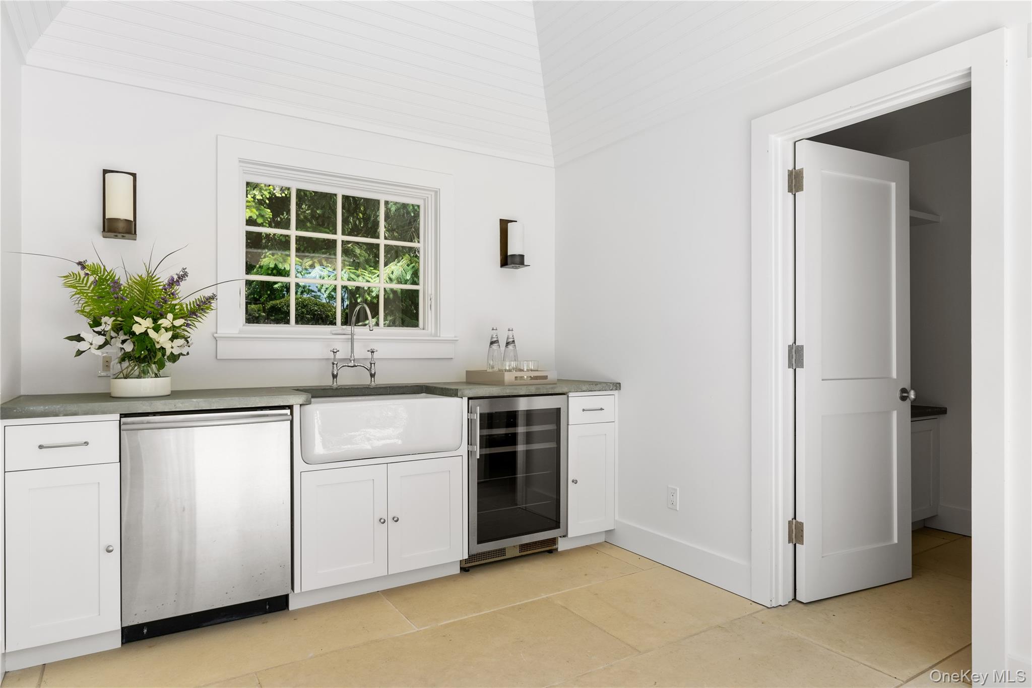 182 Church Lane Bridgehampton, NY 11932 - Photo 33 of 37 a kitchen with white cabinets and a sink