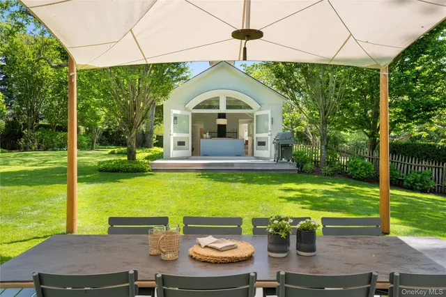 a view of a swimming pool with a yard