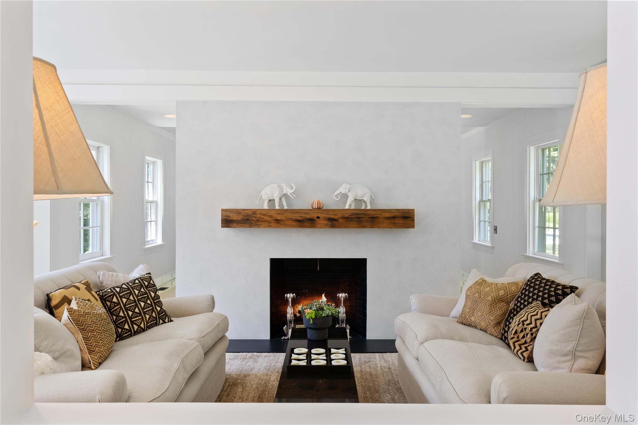 182 Church Lane Bridgehampton, NY 11932 - Photo 7 of 37 a living room with furniture and a fireplace