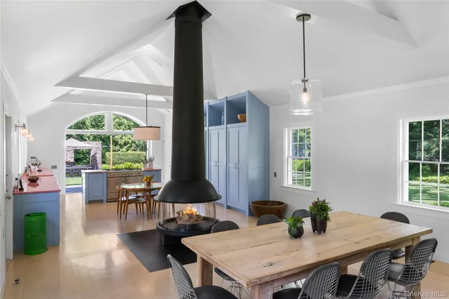 a view of a dining room with furniture window and outside view