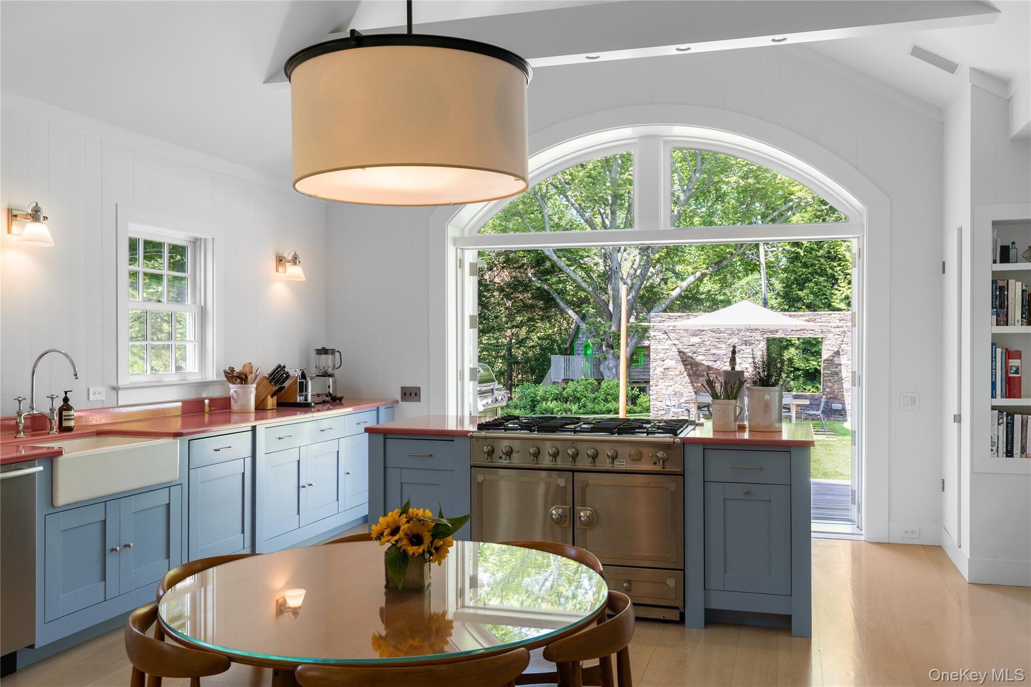 182 Church Lane Bridgehampton, NY 11932 - Photo 10 of 37 a dining room with a window and kitchen view