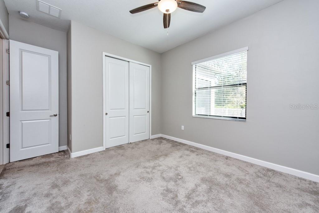 13315 Orca Sound Drive Riverview, FL 33579 - Photo 16 of 52 a view of an empty room with a window