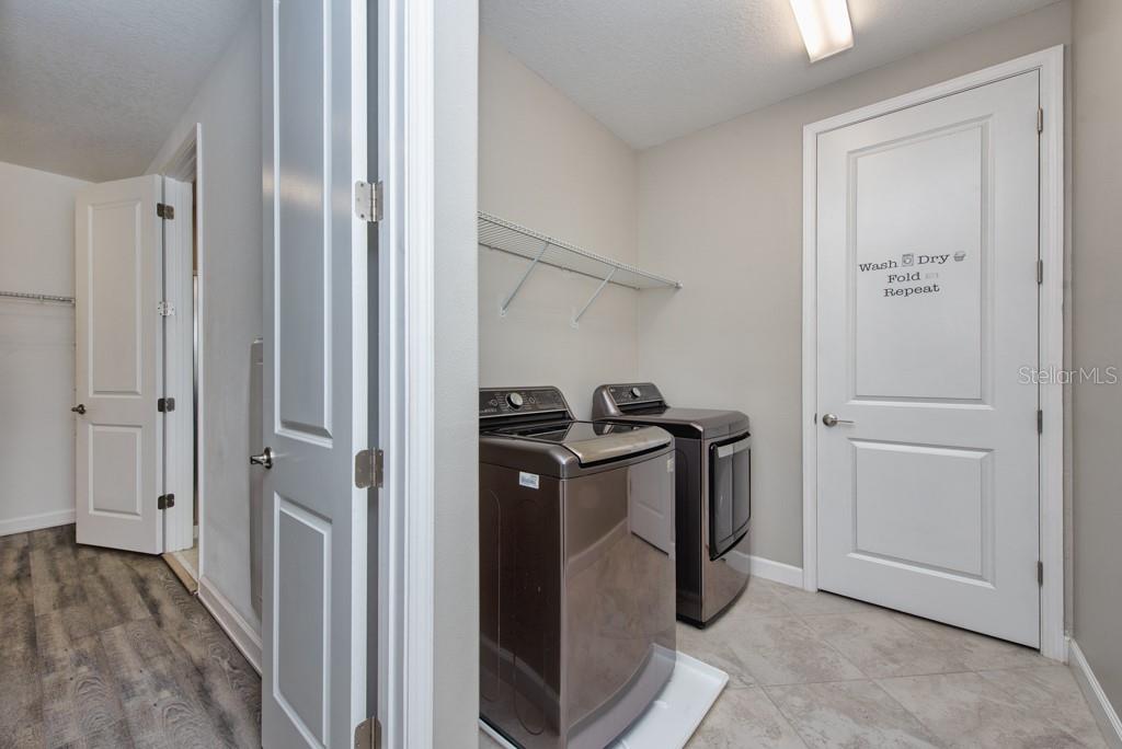 13315 Orca Sound Drive Riverview, FL 33579 - Photo 24 of 52 a view of walk in closet with clothes and shoes