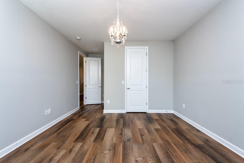 13315 Orca Sound Drive Riverview, FL 33579 - Photo 26 of 52 a view of empty room with wooden floor and window