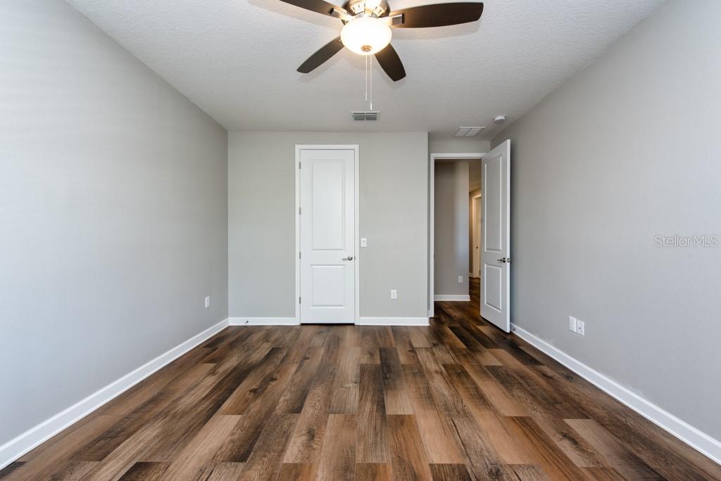 13315 Orca Sound Drive Riverview, FL 33579 - Photo 28 of 52 a view of empty room with wooden floor