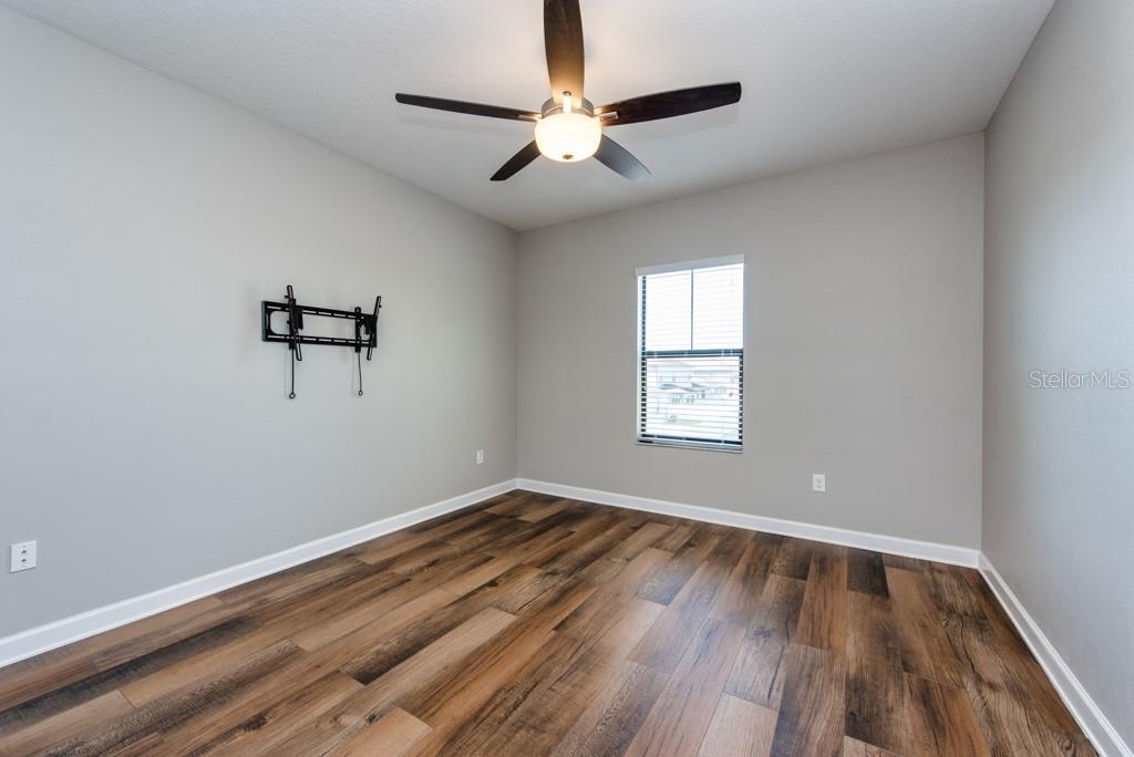 13315 Orca Sound Drive Riverview, FL 33579 - Photo 29 of 52 wooden floor in an empty room with a window