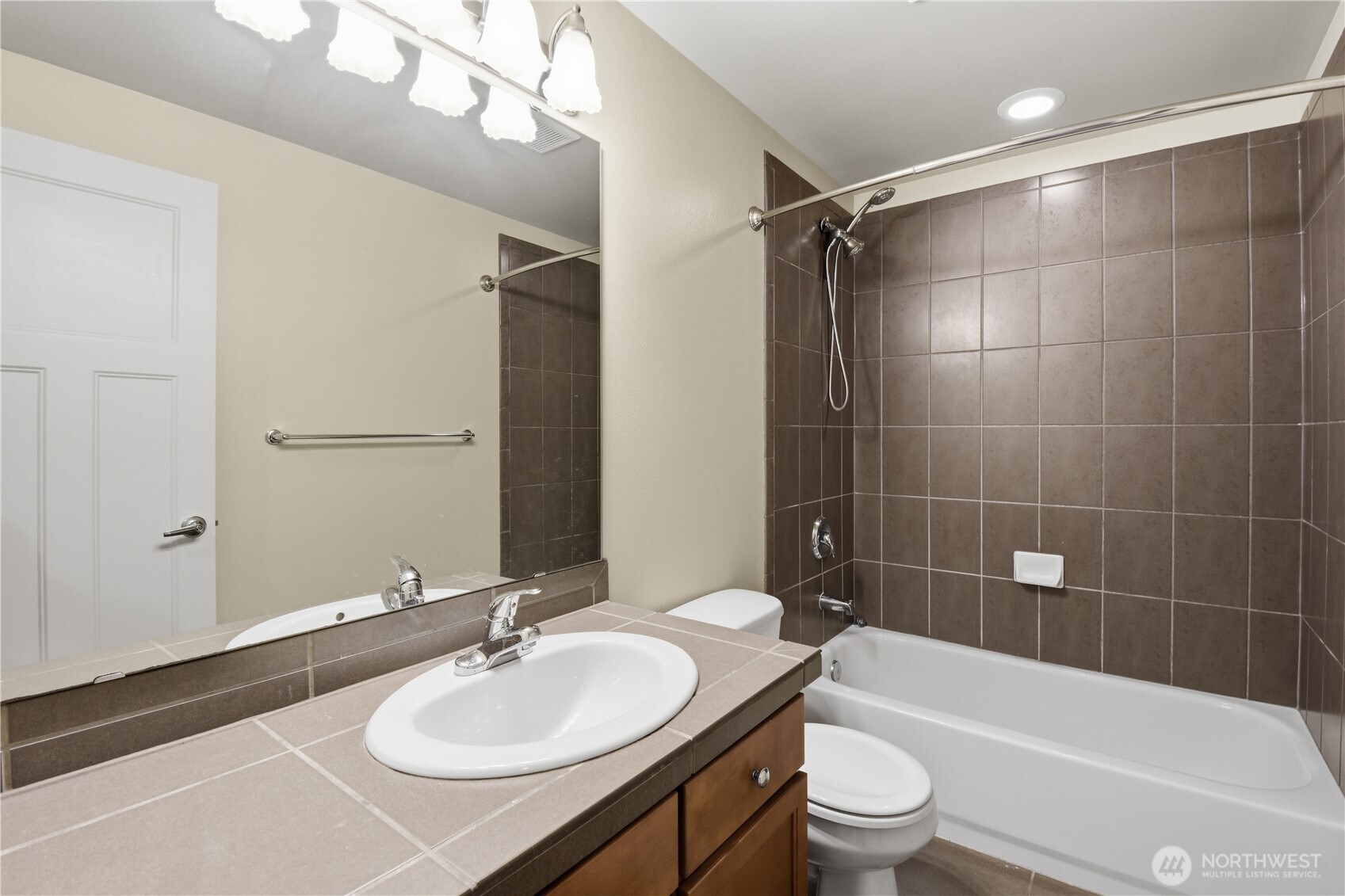 723 North 95th Street, Unit A Seattle, WA 98103 - Photo 9 of 20 a bathroom with a sink a toilet and shower