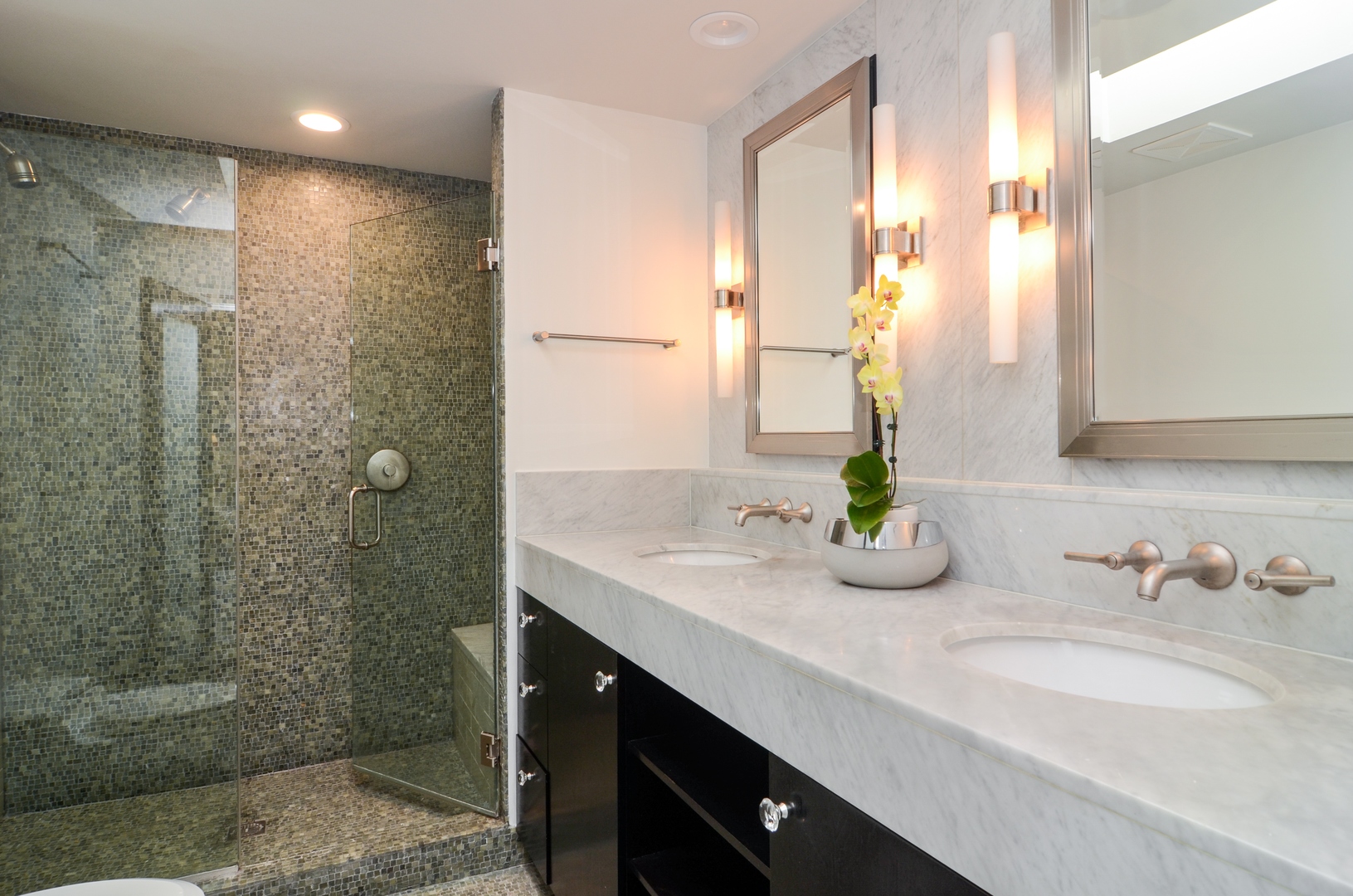 1014 West Grace Street Chicago, IL 60613 - Photo 17 of 24 a bathroom with a double vanity sink and a mirror