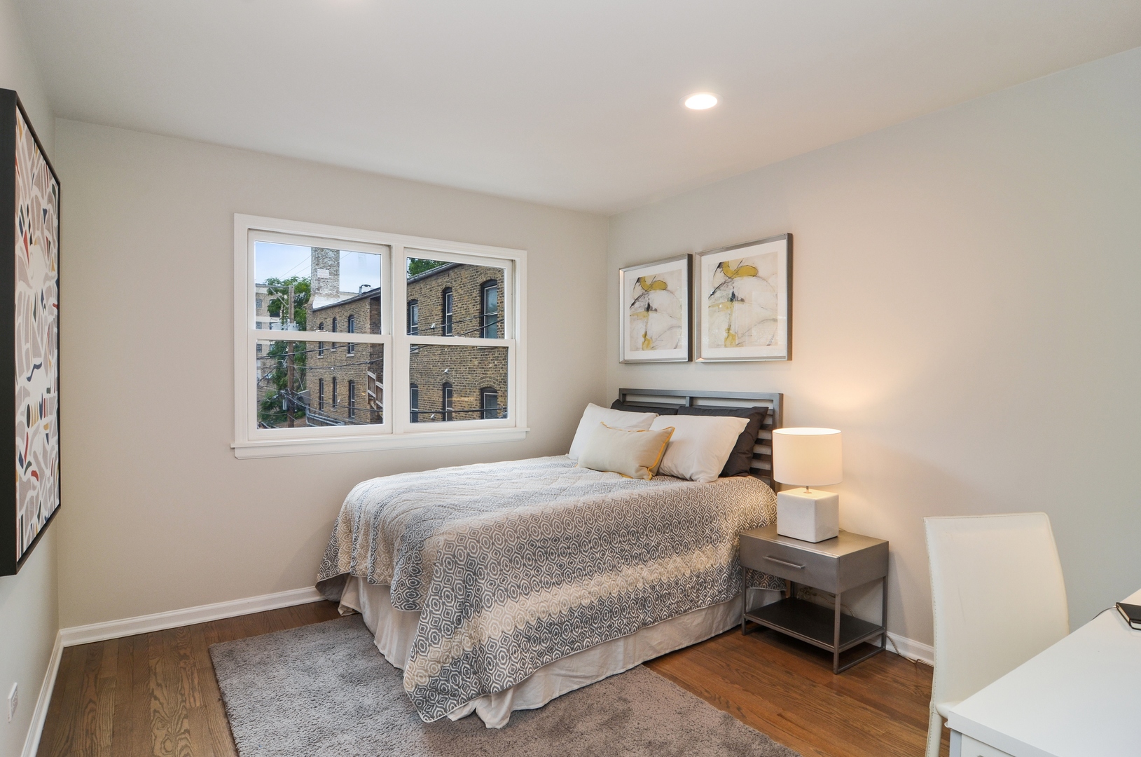1014 West Grace Street Chicago, IL 60613 - Photo 18 of 24 a bedroom with a bed and a window