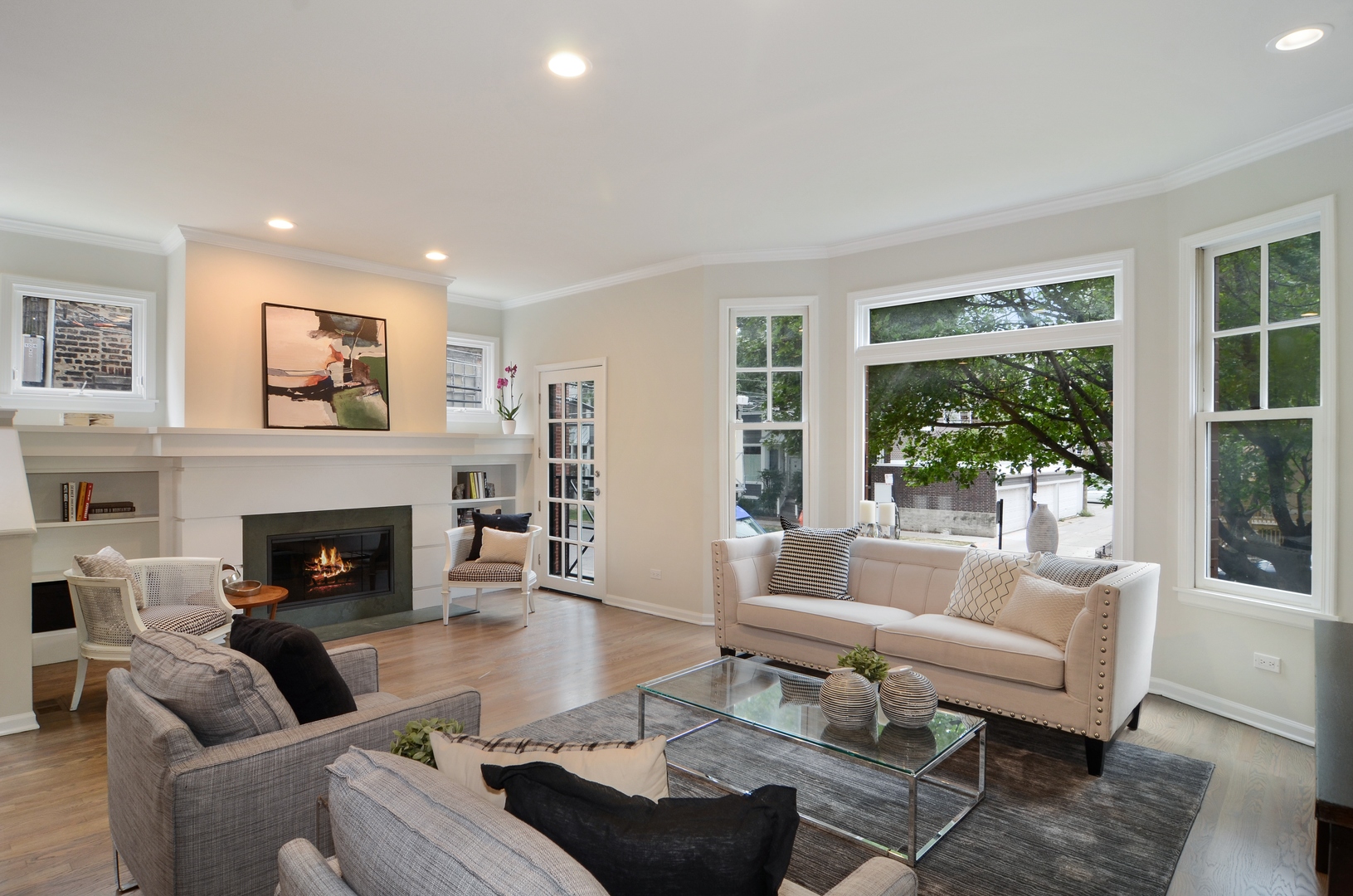 1014 West Grace Street Chicago, IL 60613 - Photo 4 of 24 a living room with furniture fireplace and large windows