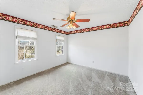a view of a room with toys and wooden floor