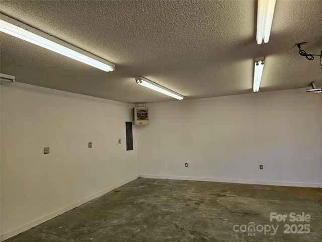 a sign that is sitting on a brick wall