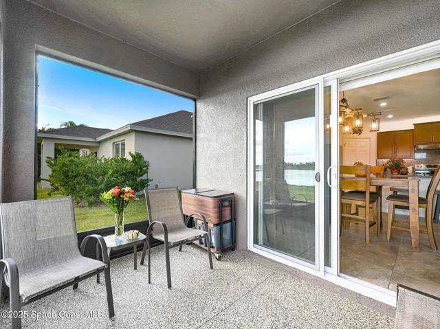 a front view of house with yard and outdoor seating