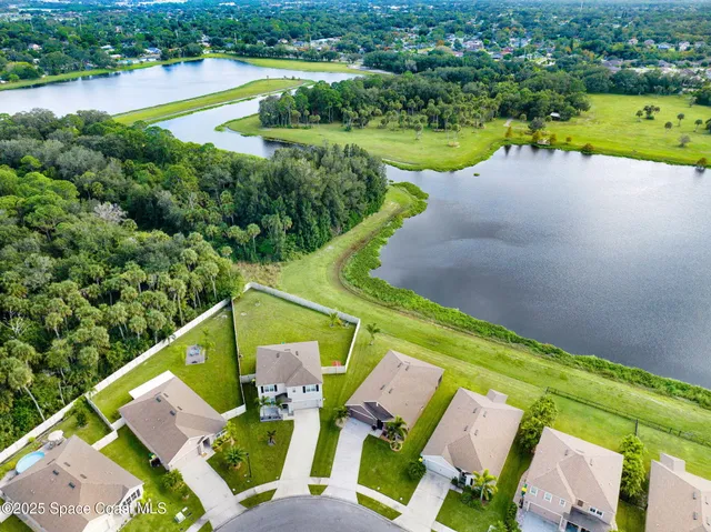 a aerial view of a house with a lake view