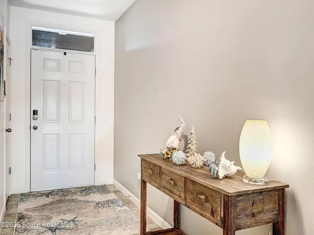 a kitchen with kitchen island a counter top space cabinets and stainless steel appliances