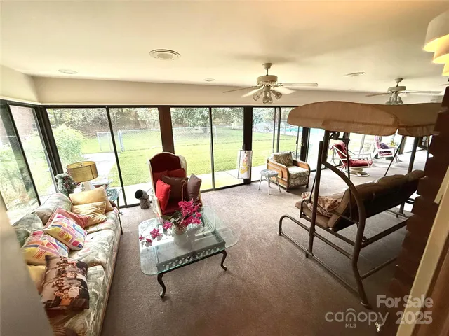 a spacious bedroom with a bed and a tv in it