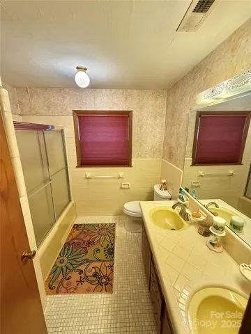 a bedroom with bed and window