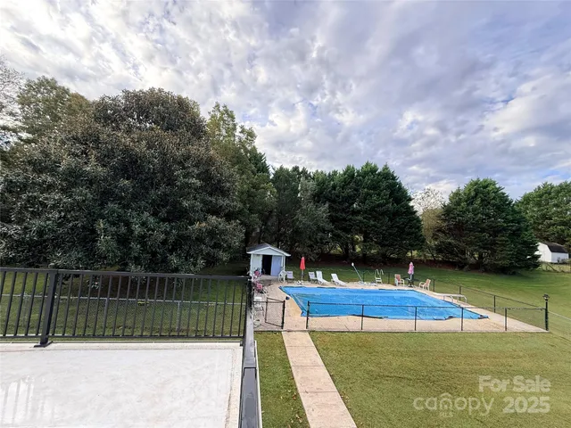 a view of a backyard with a fence