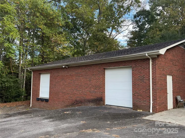 a kitchen with stainless steel appliances granite countertop a sink and a refrigerator