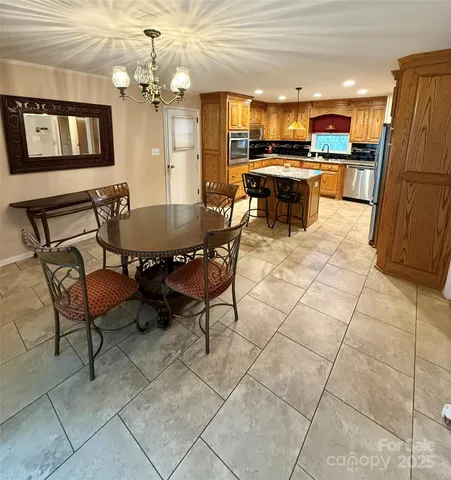 a kitchen with a stove a sink and a microwave