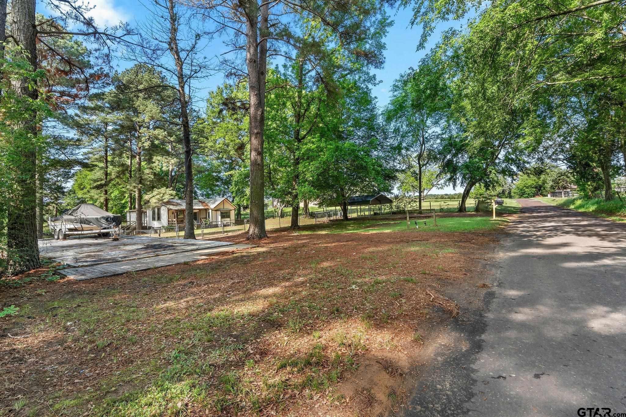 4550 Crabapple Road Gilmer, TX 75645 - Photo 33 of 33 a view of a road with large trees