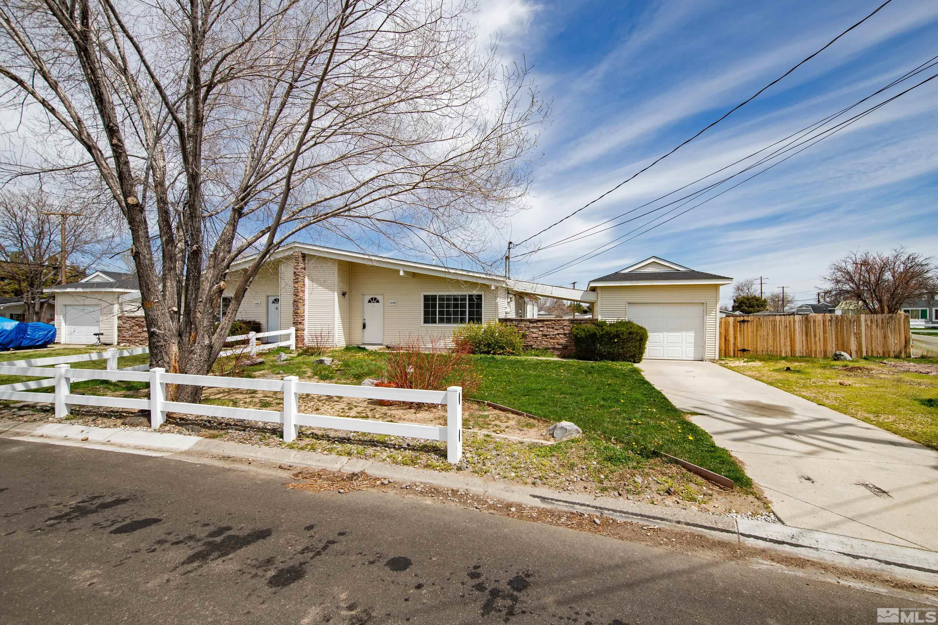 12190 Himalaya Street Reno, NV 89506 - Photo 1 of 34 a front view of a house with a yard