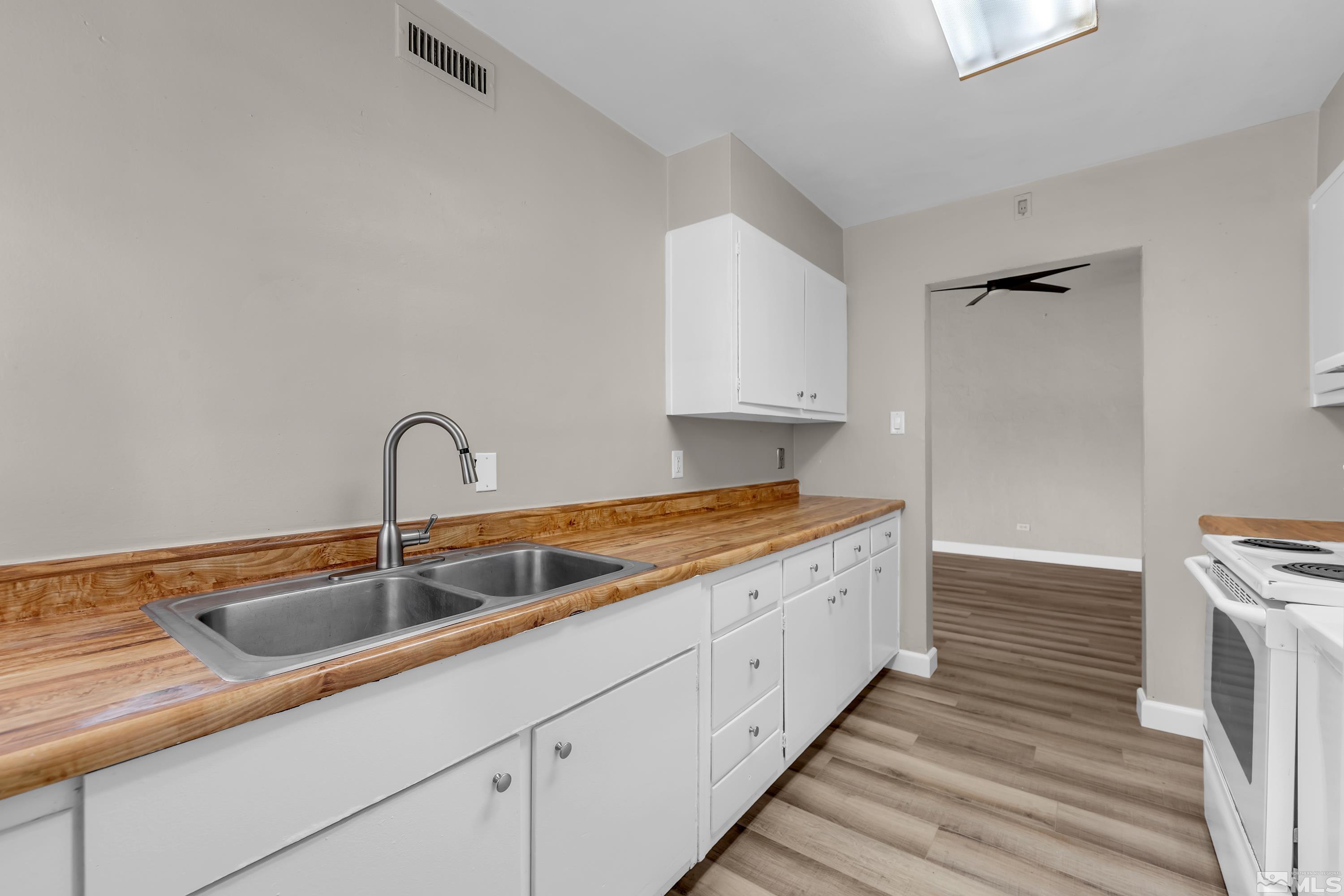 12190 Himalaya Street Reno, NV 89506 - Photo 12 of 34 a kitchen with sink and cabinets
