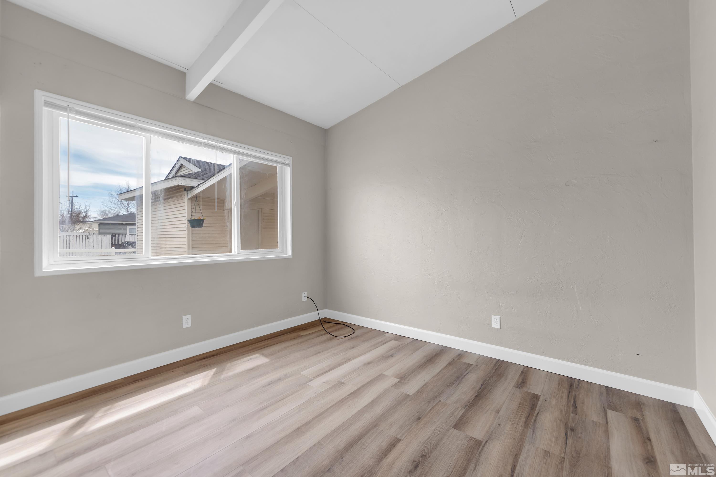 12190 Himalaya Street Reno, NV 89506 - Photo 18 of 34 a view of empty room with wooden floor and fan