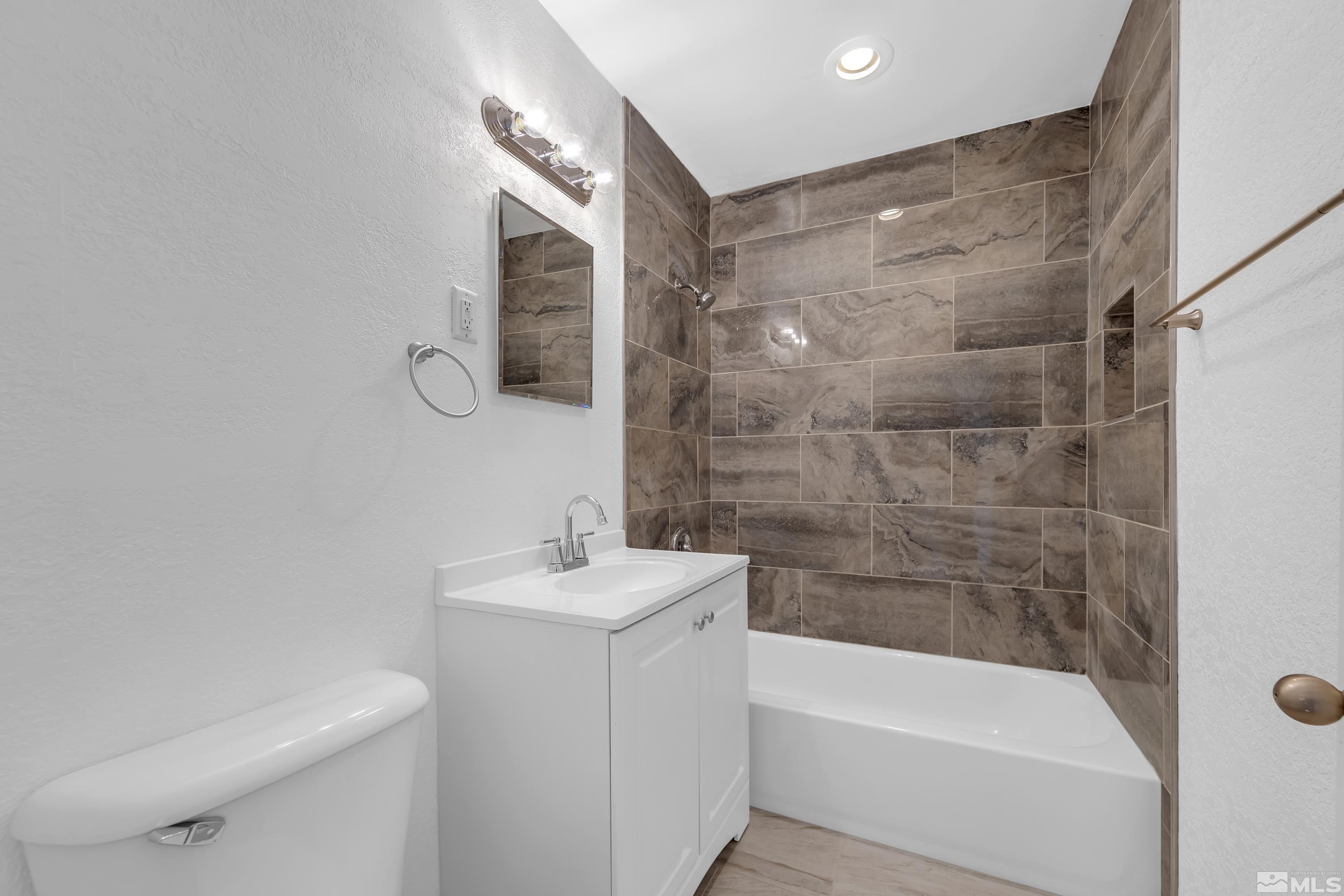 12190 Himalaya Street Reno, NV 89506 - Photo 20 of 34 a bathroom with a sink a toilet and shower