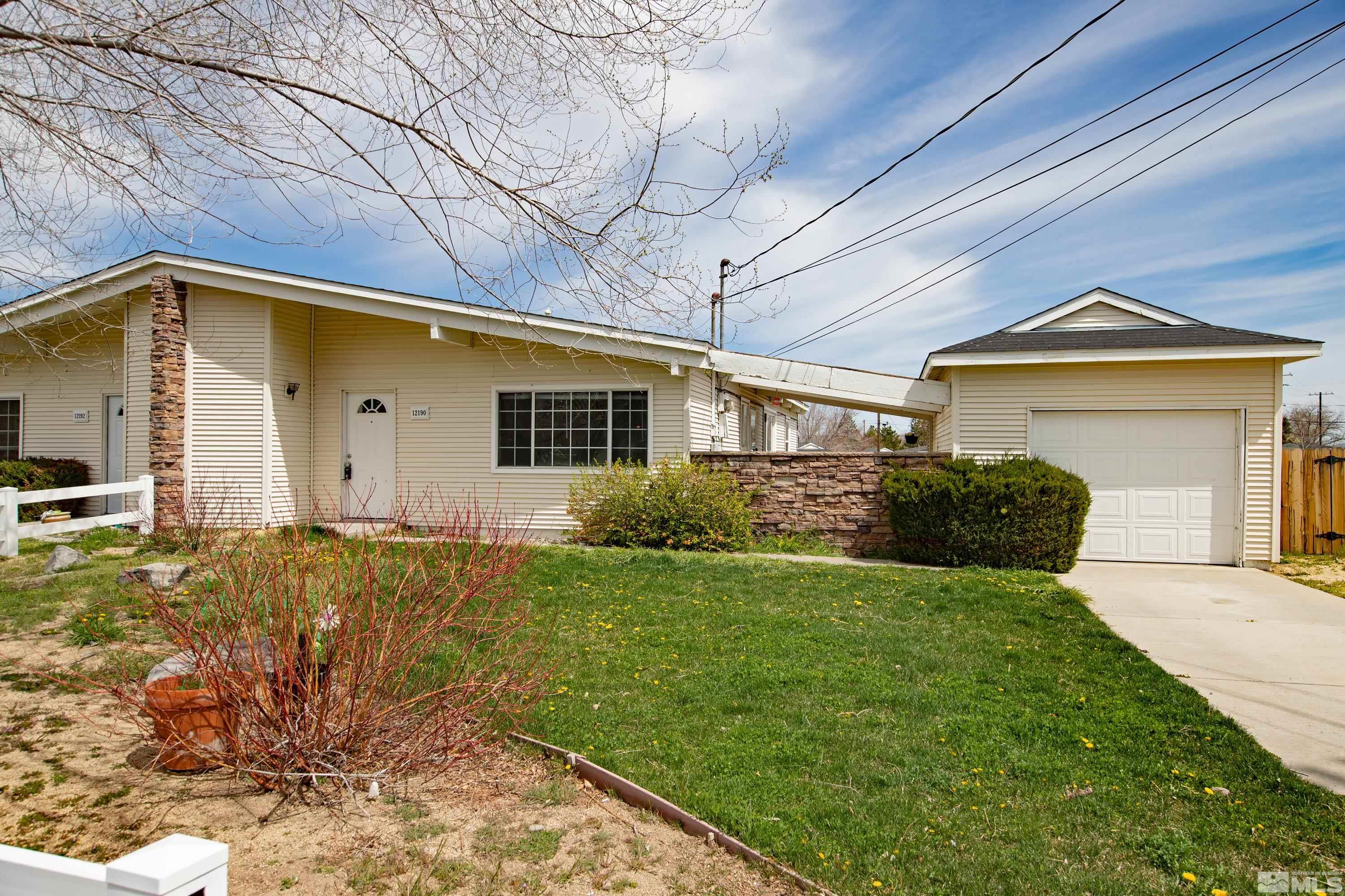 12190 Himalaya Street Reno, NV 89506 - Photo 23 of 34 a front view of a house with garden