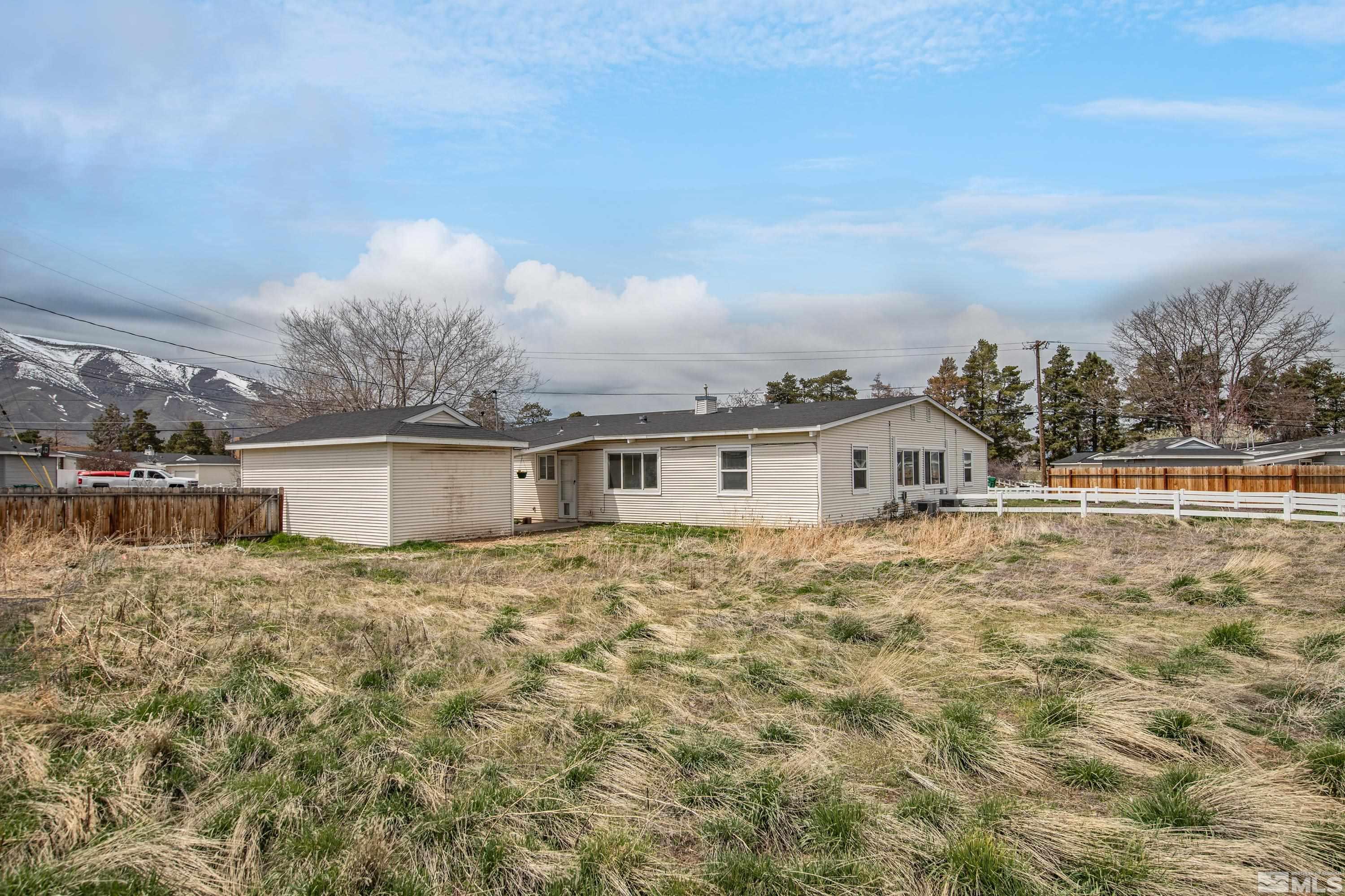 12190 Himalaya Street Reno, NV 89506 - Photo 28 of 34 a house view with a garden space