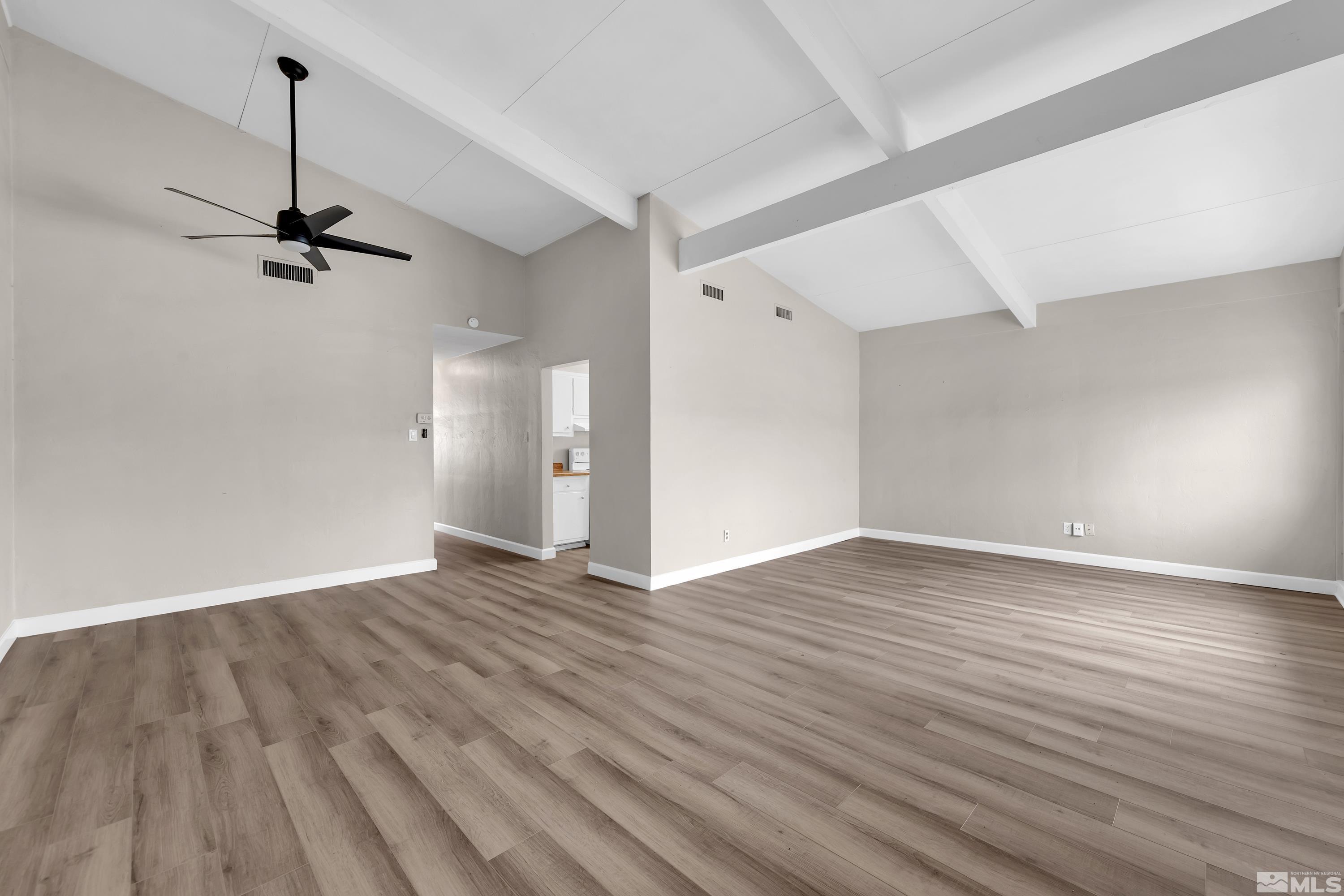 12190 Himalaya Street Reno, NV 89506 - Photo 4 of 34 a view of empty room with wooden floor