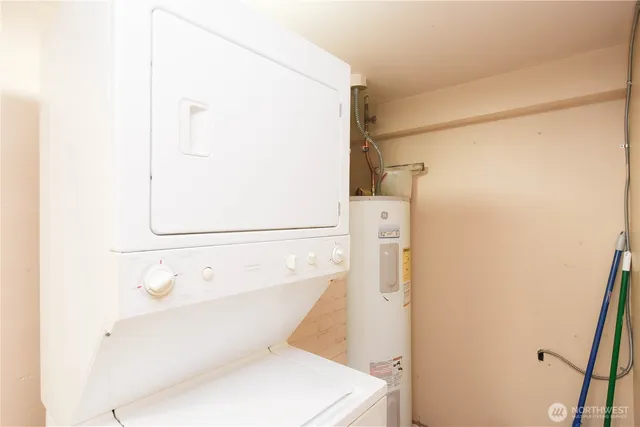 a bathroom with a white toilet and a shower