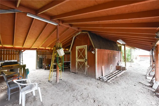 a view of a garage with wooden floor