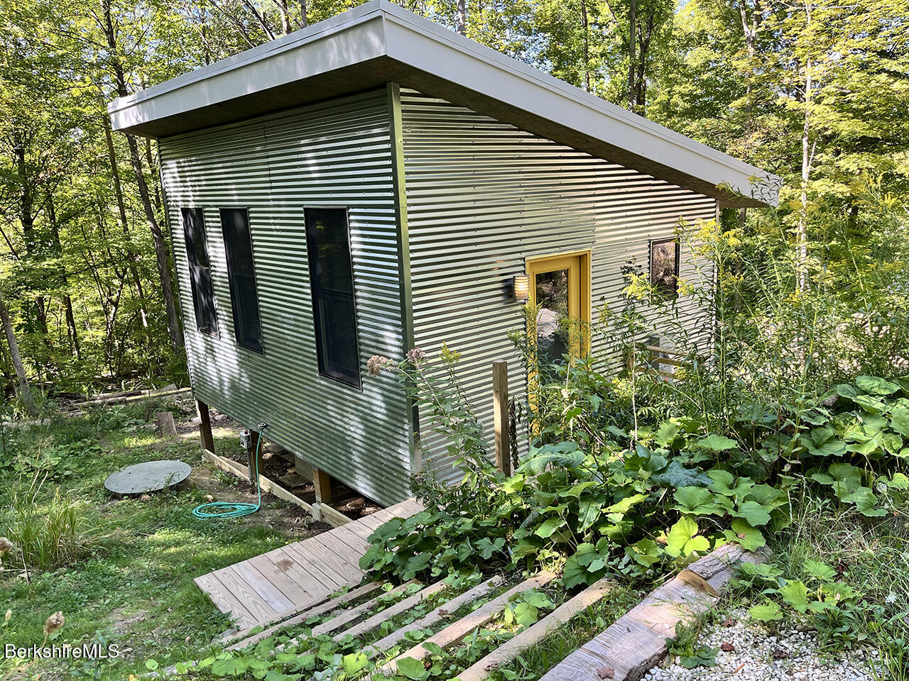 447 Notch Road North Adams, MA 01247 - Photo 1 of 16 a front view of a house with garden