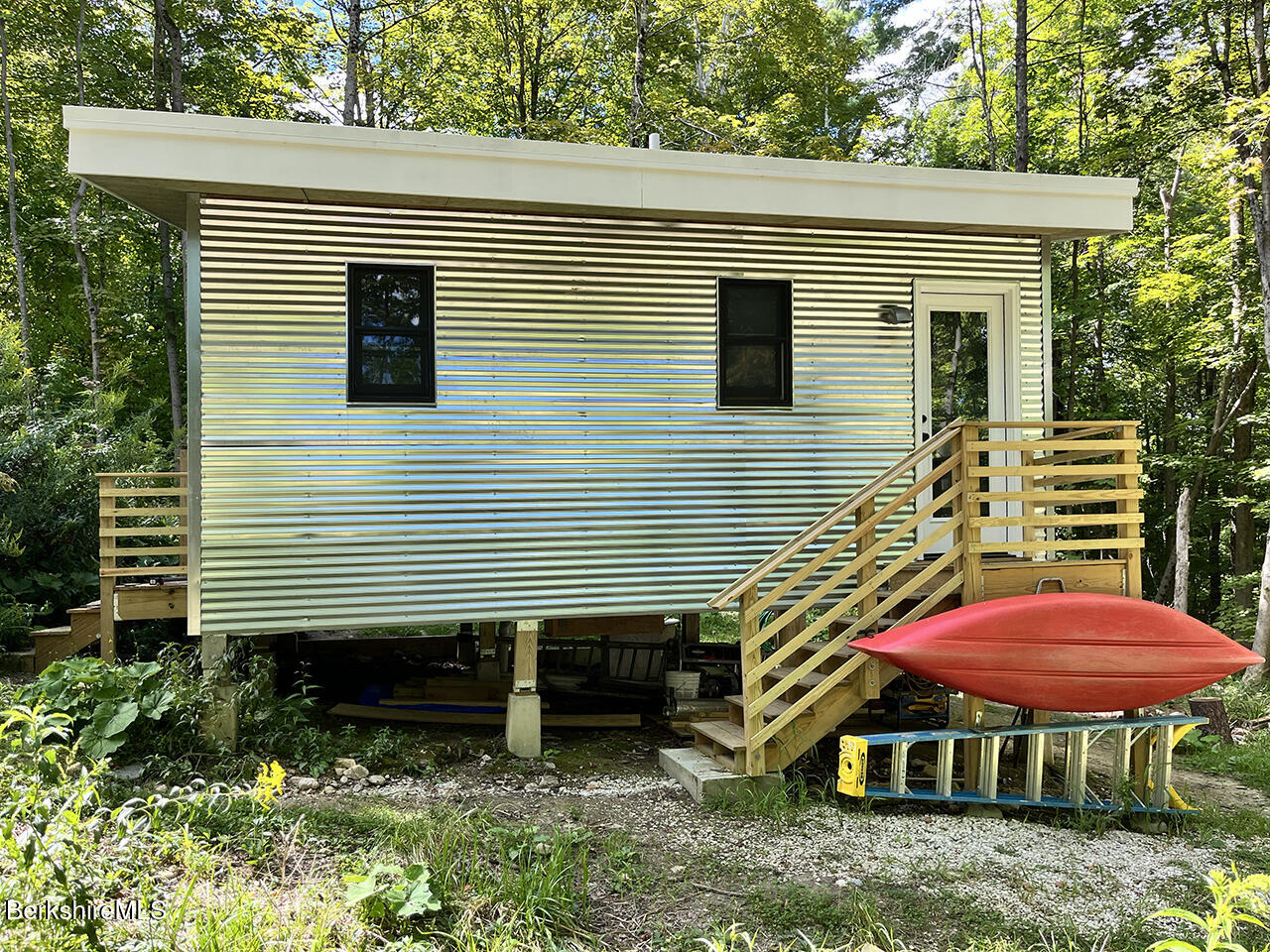 447 Notch Road North Adams, MA 01247 - Photo 13 of 16 a backyard of a house with table and chairs