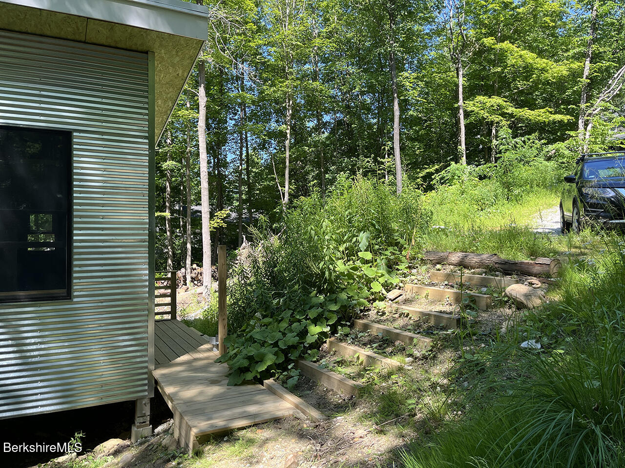 447 Notch Road North Adams, MA 01247 - Photo 3 of 16 a backyard of a house with lots of green space