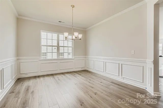 a kitchen with stainless steel appliances a refrigerator sink and microwave